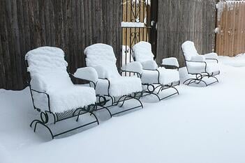 patio chairs in snow